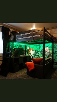 a bedroom with graffiti on the walls and a bunk bed in the middle is lit up by green lights