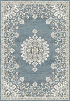 a blue and white rug with an ornate design on the center, surrounded by flowers