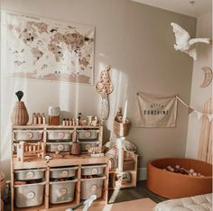 a living room filled with lots of furniture and storage containers on top of wooden shelves