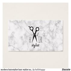 a marble business card with scissors on it that says, modern hair stylist