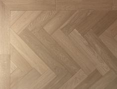 an image of wood flooring that looks like herringbones