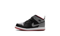 The Air Jordan 1 Mid TD “Black/Cement Grey” is the toddler sizing of the lifestyle shoe with a neutral-colored look.  The “Black/Cement Grey” Jordan 1 Mid TD features a Cement Grey leather on the perforated toe, collar, and heel, and black leather on the toe cap, forefoot, eyelets, and mid-panel.  A Cement Grey leather Swoosh appears on both sides, and a “Wings” logo is found on the collar.  A Fire Red Jumpman is located on the tongue tag, while a pull tab on the heel assists with on/off wearabi Jordan New, Kids Jordan, Grey Jordans, White Jordans, Black Cement, Cement Gray, Wings Logo, Stadium Goods, Kids Jordans