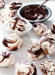 cupcakes with chocolate frosting and a bowl of peanut butter