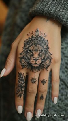 45+ Lion Tattoo Ideas to Give You Inspiration for Your Next Ink Lioness Hand Tattoo For Women, Girly Hand Tattoos, Lion Tattoo Ideas, Lion Hand Tattoo, Mama Tattoo, Ink Therapy, Lion Tattoos, Tattoo Zeichnungen, Cross Tattoo Designs