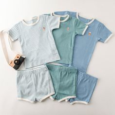 Looking for a cute outfit to wear this summer? This Baby/Toddler's Embroidery Ice Cream Print T-shirt and Shorts is perfect for any occasion. The material is soft cotton, which will keep your little one comfortable all day long. The fit is normal size, so it should be easy to find clothes that will fit them too. Brand Name: Kidsyard GreenlandMaterial: 100% Premium COTTONGender: UnisexFit: Normal Size FitSleeve Length: ShortsleeveInclude: T-shirt/Shorts/SetMachine wash, tumble dryImported Playful Cotton Bottoms In Matching Set, Playful Cotton Short Set For Summer, Blue Cotton Family Matching Sets, Blue Cotton Short Set For Summer, Light Blue Cotton Loungewear Sets, Light Blue Cotton Lounge Sets, Family Matching Cotton Playwear Sets, Family Matching Cotton Sets For Playwear, Family Matching Loungewear Sets With Short Sleeves