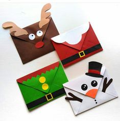 four christmas envelopes with different designs on them, one has a reindeer and the other has a snowman