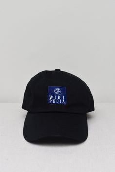 "Wikipedia Embroidered Black Dad hat. This one's got a low profile with an adjustable strap and curved visor. * 100% chino cotton twill * Unstructured, 6-panel, low-profile * 6 embroidered eyelets * 3 ⅛\" (7.6 cm) crown * Adjustable strap with antique buckle * Blank product sourced from Vietnam or Bangladesh" Black Dad Hat, Dad Hat, Trucker Cap, Dad Hats, Low Profile, Cotton Twill, Caps Hats, Accessories Hats, Mood Board