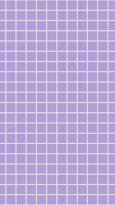 a purple tiled wall with white squares