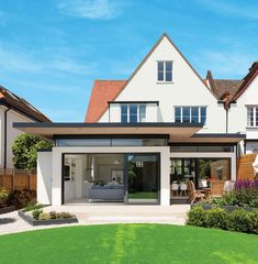 a large white house with an open patio