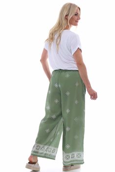 Get ready to elevate your style with our Fazara Print Trousers. These trousers feature an elasticated waistband with drawstring for the perfect fit, as well as a wide leg patterned design. Stay on trend and comfortable all day long in these fashionable trousers. - Wide leg - Drawstring waistband - Pockets Khaki Colour, Navy And Khaki, Printed Trousers, Drawstring Waistband, Get Ready, Black And Navy, Size Clothing, Pattern Design, Overalls