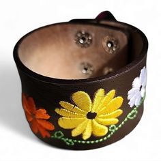 Nwot Faux Leather Cuff Bracelet With Embroidered Flower Appliqus. Snap Closure. Brown Bracelet Wristlet As Gift, Handmade Brown Flower Bracelets, Brown Adjustable Flower Bracelet, Brown Cuff Bracelets As Fashion Accessory, Multicolor Leather Bracelets, Brown Cuff Bracelet As Fashion Accessory, Adjustable Brown Jewelry For Spring, Floral Cuff, Leather Cuff Bracelet