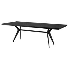 a black table sitting on top of a white floor