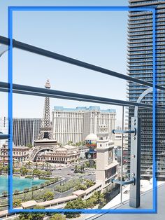 a balcony overlooking the eiffel tower in las vegas, with blue frame around it