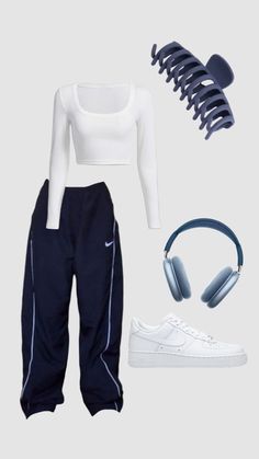 a white top and black pants with headphones