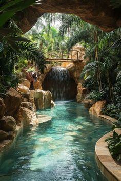 a man is standing in the middle of a pool surrounded by palm trees and water