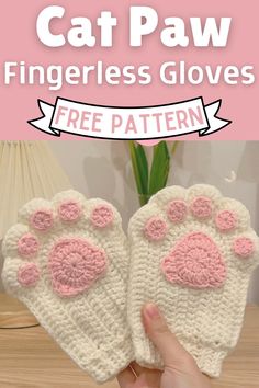 the cat paw fingerless gloves are crocheted with pink and white yarn