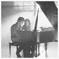 the story book is shown with two people sitting at a piano in front of a window