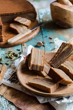 pieces of brownie sitting on top of a wooden plate