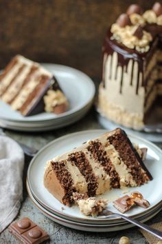 two slices of cake on plates with chocolate and white frosting, one slice missing