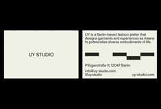 a business card with the words uy studio in black and white, on a black background