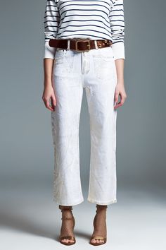 Step into a world of elegance and style with our White Wide Leg Jeans, designed to make a statement at any event. Premium Quality Fabric: Crafted from 100% Cotton, these jeans offer both comfort and durability. Model's Perfect Fit: Our model, standing tall at 5'9" with measurements of 33-25-36, wears a size S, providing a great reference for finding your ideal fit. Striking Gold Metallic Finish: The unique gold metallic finish across the jeans adds a luxurious and eye-catching touch, perfect for White Wide Leg Jeans, Model Standing, Types Of Jeans, Pants Fit, Style Party, Denim Details, Polished Look, Large White, Casual T Shirts