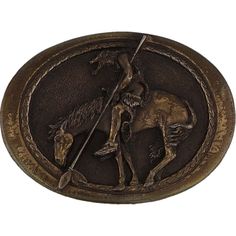 This "End of the Trail" buckle features a weary Native American warrior on horseback, symbolizing the resilience of the Plains people. Add this meaningful piece to your collection today! Product Details: Maker: The Great American Buckle Co Material: Brass Plated Metal Measurements: 3.03" (W) X 2.23" (H) Fits Belt Width: Up to 1.75" Weight: 146 G Decade: 1980s Condition:  Why This Buckle is Special: In line with our motto, Accessories for Your Vintage Soul, this belt buckle is a portal to the pas Native American Western, End Of The Trail, Plain People, Native American Warrior, American Western, The Great, Vintage Soul, Vintage Belt Buckles, Vintage Lover