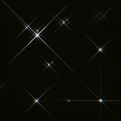 an abstract black background with stars and sparkles