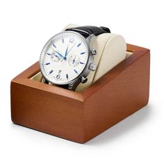 The "Gaïa" Wooden Watch Holder with White Cushion combines the sturdiness of wood with the softness of a white cushion for an elegant display of your watches. Meticulously crafted, this stand is ideal for showcasing and protecting your watches, whether for personal or professional use. Exceptional Features: High-Quality Materials: Made from Fraxinus Mandshurica wood and microfiber fabric, ensuring durability and softness. Elegant Design: The contrast between the natural wood and the white microf Wood Watch Box, Watch Display Case, Watch Gift Box, Watch Organizer, Bar Accessories Decor, Watch Stand, Watch Storage Box, Watch Holder, Watch Storage