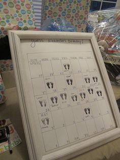 a white framed calendar with clothes drawn on it