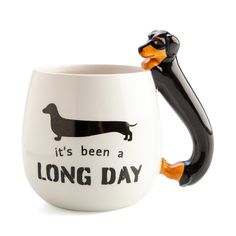 a black and orange dachshund mug with the words it's been a long day