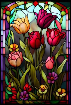 a stained glass window with flowers in it