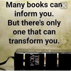 a book sitting on top of a wooden table next to a wall with the words, many books can inform you but there's only one that can transform you