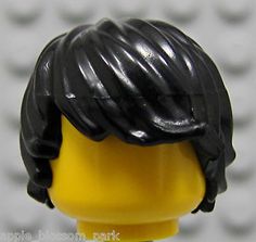 there is a lego man with a black hair