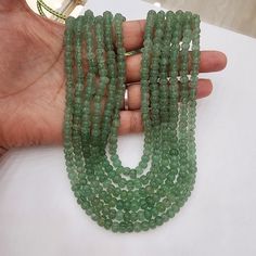 Add a touch of universal elegance with this Six-Layered Emerald Pumpkin Beads Necklace, perfect for both men and women, including groom jewelry. This versatile piece showcases rich, faceted emerald beads in a bold, multi-strand design that radiates sophistication. Ideal for anyone aiming to make a statement, it lends a luxurious and regal touch to any ensemble, suitable for weddings, formal events, or significant occasions. Material : Natural pumpkin shaped Russian quartz with adjustable silk th Emerald Rondelle Faceted Beads Jewelry, Formal Emerald Necklace With Round Gemstone Beads, Formal Emerald Necklace With Faceted Round Beads, Classic Green Beaded Necklaces With Round Beads, Spiritual Beaded Emerald Necklace With Round Beads, Emerald Faceted Beaded Necklaces, Elegant Green Faceted Beads Gemstones, Spiritual Emerald Beaded Necklace With Round Beads, Emerald Single Strand Jewelry With Round Beads