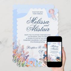 a person holding up a cell phone next to a wedding card with an octopus on it