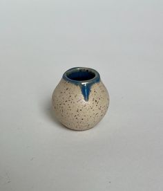 Mini ceramic vase. Speckled bmix glazed blue on the interior. Thrown on the pottery wheel. Fired to cone 5 in an electric kiln. 1.25L x 1.25W x 1.3H (inches) Mini Vase, Keramik Vase, Pottery Wheel, Fine Art Ceramics, Ceramic Vase, Halloween Shopping, Vase, Collectibles, Electronic Accessories