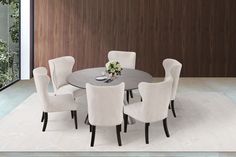 a round table with white chairs around it