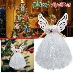 a christmas ornament with angel wings in front of a christmas tree and an image of a doll