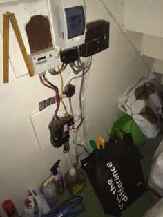 a room with various electrical equipment and tools on the wall, including an electric meter