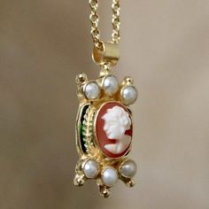 The ancient art of the cameo-or relief carving on sea shells - was revived in the Victorian era but was prefected by the Edwardians. This Italian cameo is framed in 24k gold over sterling silver filigree setting with cultured pearls, granulation and enamel. Pendant comes with a 14" link chain. Cameo Necklace 1stdibs, Luxury Elegant Cameo Necklace, Luxury Heirloom Cabochon Necklace, Antique Pendant Jewelry For Opera, Luxury Oval Jewelry For Opera, Antique Gold Jewelry For Opera, Victorian Oval Jewelry For Opera, Victorian Pendant Jewelry For Opera, Victorian Gold Jewelry For Opera