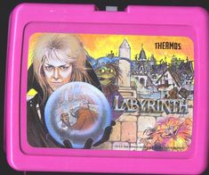 a pink lunch box with an image of the movie labyrinth on it