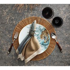 a place setting with napkins and silverware