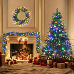 two christmas trees in front of a fireplace with presents under them and lights on the mantle