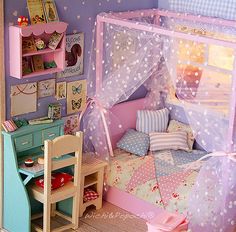 a doll house with a bed, desk and chair in the room that is made to look like a princess's bedroom