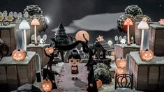 an animated halloween scene with pumpkins, jack - o - lanternes and other decorations