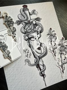 an ink drawing of a woman's face with snakes around her neck and two key chains attached to it