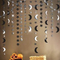 the moon and stars are hanging on the wall