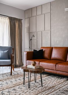 a living room with two couches and a coffee table in front of a window