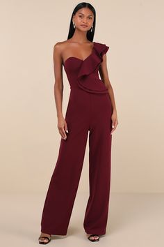 Spend an evening falling in love with the Lulus Kiss Me Again Burgundy Ruffled One-Shoulder Jumpsuit! Medium-weight, stretchy crepe knit sweeps from a double-tiered, flouncy one-shoulder strap and into a princess-seamed bodice (with hidden no-slip strips). High, fitted waist tops wide pant legs that fall to ankle-length hems. Hidden back zipper/clasp. Fit: This garment fits true to size. Length: Floor length. Size medium measures 60" from shoulder to hem. Inseam: 32.75 Front Rise: 15.00 Bust: Gr Country Wedding Guest Dress, Jumpsuit For Wedding Guest, Burgundy Jumpsuit, Casual Formal Dresses, Formal Jumpsuit, One Shoulder Jumpsuit, Casual Wedding Dress, Jumpsuit Party, Wide Pants