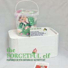 an elf's christmas gift in a plastic container with the message, the forgetful elf